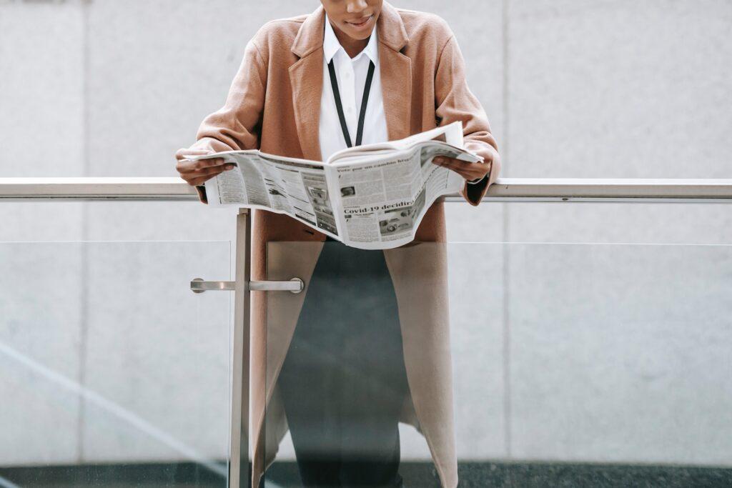 A Woman reads a Newspaper
